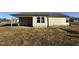 House exterior showcasing a covered patio and backyard at 128 Pate Landing Dr, Selma, NC 27576
