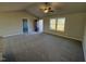 Open living area with neutral colors and ceiling fan at 128 Pate Landing Dr, Selma, NC 27576