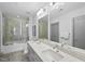 Bathroom boasts double vanity with marble countertops and large shower at 1300 St Marys St # 403, Raleigh, NC 27605