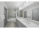 Modern bathroom features a double vanity and glass-enclosed shower at 1300 St Marys St # 403, Raleigh, NC 27605