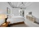 Bright bedroom with ceiling fan, large windows and plush bedding at 1300 St Marys St # 403, Raleigh, NC 27605