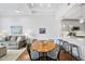 Light and airy dining area with wood table and seating for four at 1300 St Marys St # 403, Raleigh, NC 27605