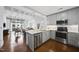 Bright kitchen boasts stainless appliances, quartz countertops, and an island with pendant lighting at 1300 St Marys St # 403, Raleigh, NC 27605