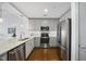 Modern kitchen with stainless steel appliances and marble countertops at 1300 St Marys St # 403, Raleigh, NC 27605