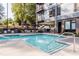 Inviting community pool area features ample seating and lush landscaping at 1300 St Marys St # 403, Raleigh, NC 27605