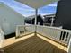 A clear view of the home's wooden back deck on a sunny day, surrounded by neighboring houses at 1364 Barreto Dr, Wendell, NC 27591