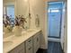 A well-lit bathroom features a dual sink vanity and a step-in shower with white subway tiles at 1364 Barreto Dr, Wendell, NC 27591