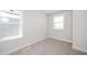 Bright bedroom featuring neutral carpet, a double window and light grey walls at 1364 Barreto Dr, Wendell, NC 27591