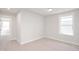 Bright bedroom with neutral carpet and light grey walls, plus lots of light at 1364 Barreto Dr, Wendell, NC 27591