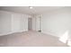 Bright bedroom featuring neutral carpet and three bright white doors for easy access at 1364 Barreto Dr, Wendell, NC 27591