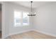 Bright dining room features neutral color palette and stylish light fixture at 1364 Barreto Dr, Wendell, NC 27591