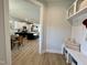 Welcoming entryway featuring built-in storage and a view of the open-concept kitchen and dining area at 1364 Barreto Dr, Wendell, NC 27591