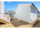Back exterior with white staircase from the porch to the yard and light blue siding at 1364 Barreto Dr, Wendell, NC 27591