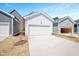 Exterior shot of three garages with white doors and light blue siding at 1364 Barreto Dr, Wendell, NC 27591