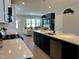 Open-concept view of kitchen with island and adjacent living room showcasing an inviting layout at 1364 Barreto Dr, Wendell, NC 27591