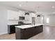 Well-appointed kitchen with white cabinetry, stainless steel appliances, and stylish lighting at 1364 Barreto Dr, Wendell, NC 27591
