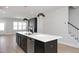 Open-concept kitchen featuring a large island, stainless steel appliances, and modern finishes at 1364 Barreto Dr, Wendell, NC 27591