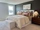 Dark-walled primary bedroom with lots of natural light and stylish decorations and comfy decor at 1364 Barreto Dr, Wendell, NC 27591