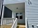 An inviting covered porch with fresh wood steps, a nice entrance to this home's exterior at 1364 Barreto Dr, Wendell, NC 27591