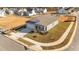 Aerial view of a gray house and yard in a new development at 14 Baird Cv Ln, Angier, NC 27501