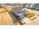 Aerial view of a gray house and yard in a new development at 14 Baird Cv Ln, Angier, NC 27501