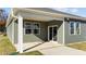 Covered back patio with sliding glass door and view of yard at 14 Baird Cv Ln, Angier, NC 27501
