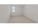 Spacious bedroom with carpet flooring and a window offering natural light at 14 Baird Cv Ln, Angier, NC 27501
