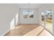 Bright dining room with hardwood floors, sliding glass doors, and chandelier at 14 Baird Cv Ln, Angier, NC 27501
