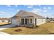 Gray Craftsman style home with white garage door and landscaping at 14 Baird Cv Ln, Angier, NC 27501