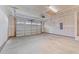 Unfinished garage with concrete floor and automatic door at 14 Baird Cv Ln, Angier, NC 27501