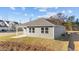 Gray house exterior, showcasing a covered patio and landscaping at 14 Baird Cv Ln, Angier, NC 27501