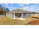 Gray house with covered patio and landscaping at 14 Baird Cv Ln, Angier, NC 27501