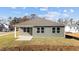 Gray house with a covered patio, showcasing its exterior at 14 Baird Cv Ln, Angier, NC 27501