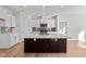 Modern kitchen with white cabinets and a large center island at 14 Baird Cv Ln, Angier, NC 27501