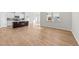 Spacious living room with hardwood floors and kitchen view at 14 Baird Cv Ln, Angier, NC 27501