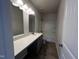 Bathroom features a modern vanity with a stone countertop and a shower-tub combo at 14 E American Marigold Dr # 65, Benson, NC 27504