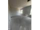 A bright and airy bedroom with multiple windows providing plenty of natural light at 14 E American Marigold Dr # 65, Benson, NC 27504