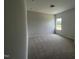 A carpeted bedroom with one window looking out onto the lawn at 14 E American Marigold Dr # 65, Benson, NC 27504