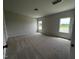 Bright bedroom with neutral carpet and two windows for natural light at 14 E American Marigold Dr # 65, Benson, NC 27504