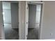 Two bedrooms with neutral walls and floors connected with open doors showcasing a clean and simple design at 14 E American Marigold Dr # 65, Benson, NC 27504