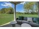 Comfortable covered patio with a cushioned outdoor sofa offering a great view of the backyard at 14 E American Marigold Dr # 65, Benson, NC 27504