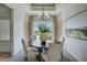 Bright dining room features a round table, stylish chandelier, and a large window with scenic views at 14 E American Marigold Dr # 65, Benson, NC 27504