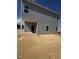 A two-story home with gray siding and a covered porch area at 14 E American Marigold Dr # 65, Benson, NC 27504