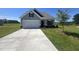 Charming home with a two-car garage, manicured lawn, and inviting curb appeal at 14 E American Marigold Dr # 65, Benson, NC 27504