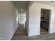 Inviting hallway with wood-look floors, leading to the kitchen and living area of the home at 14 E American Marigold Dr # 65, Benson, NC 27504