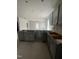 Spacious kitchen area featuring gray cabinets and ample counter space at 14 E American Marigold Dr # 65, Benson, NC 27504