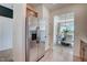 Stainless steel refrigerator complemented by an adjacent doorway into the dining room at 14 E American Marigold Dr # 65, Benson, NC 27504