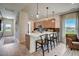 Open-concept kitchen boasts a large island with bar seating and modern pendant lighting at 14 E American Marigold Dr # 65, Benson, NC 27504