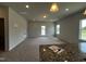Open-concept living area with kitchen island featuring a granite countertop at 14 E American Marigold Dr # 65, Benson, NC 27504