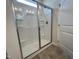 Modern bathroom showcasing a sleek glass-enclosed shower with built-in shelving and contemporary fixtures at 14 E American Marigold Dr # 65, Benson, NC 27504